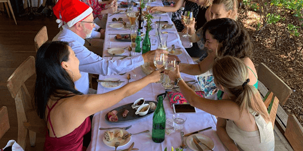 Highgate Hill Staff cheering at the Christmas party